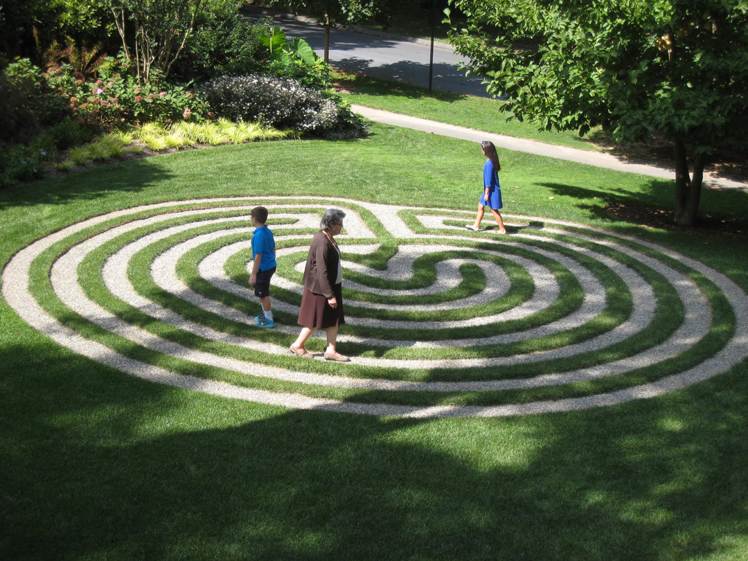 Kiera and Brock Green and their grandmother, Marian Green, enjoy a walk around the labyrinth at Vickie Baily’s house in Garrett Park, Maryland.