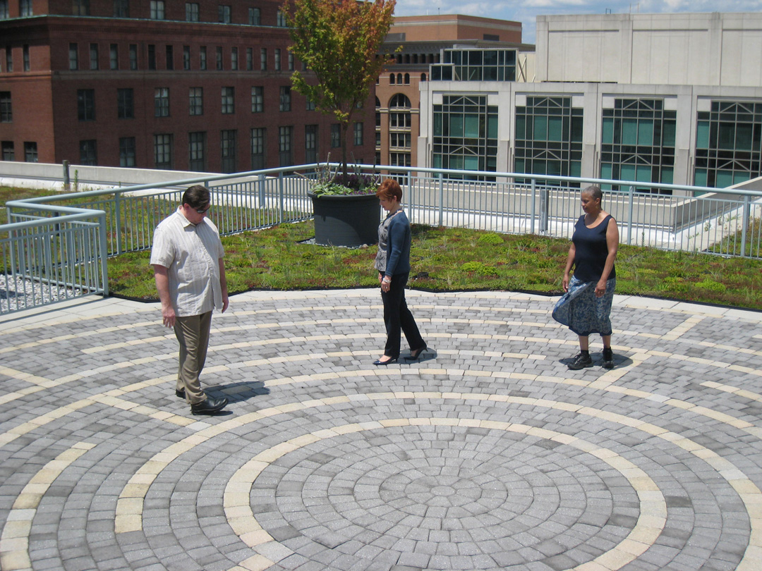 John Flanagan, Susan Hillson and Rozella Cribbs-Grant walk the labyrinth on the American Psychological Association building’s green roof.